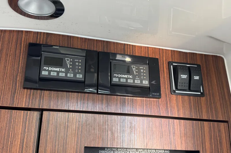 In Pursuit Yacht Photos Pics Control panel on 2019 Pursuit DC 325 Dual Console boat with Dometic systems and light switches.