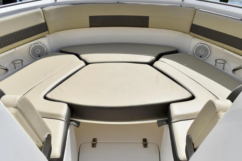 In Pursuit Yacht Photos Pics 2019 Pursuit DC 325 Dual Console boat interior with cushioned seating and speakers.