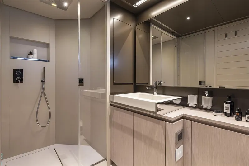 Riva Argo 90 Yacht Photos Pics Manufacturer Provided Image: Luxurious bathroom interior on 2026 Riva 90' Argo yacht, featuring modern shower and sleek vanity.