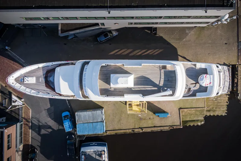 Valeria Yacht Photos Pics Aerial view of a 1975 Feadship motoryacht docked at a marina.
