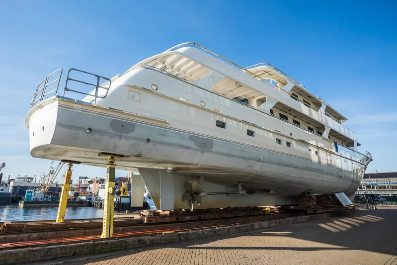 Valeria Yacht Photos Pics 1975 Feadship motoryacht on dry dock, showcasing sleek design and craftsmanship.