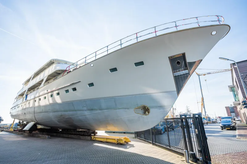 Valeria Yacht Photos Pics 1975 Feadship Motoryacht on dry dock, showcasing sleek design and craftsmanship.