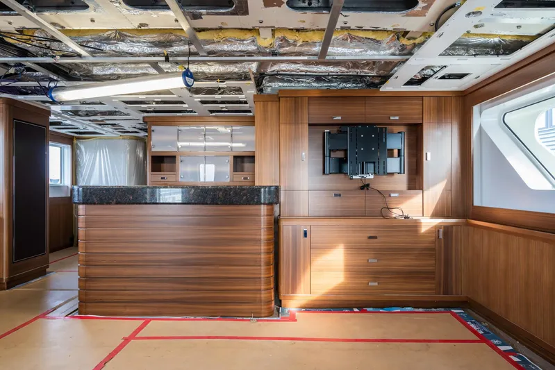 Valeria Yacht Photos Pics Luxurious 1975 Feadship motoryacht interior with wood paneling and modern design elements.