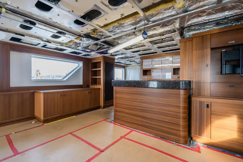 Valeria Yacht Photos Pics 1975 Feadship Motoryacht interior under renovation with wood paneling and modern design elements.