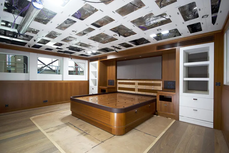 Valeria Yacht Photos Pics Luxurious interior of a 1975 Feadship motoryacht with wood paneling and modern design elements.