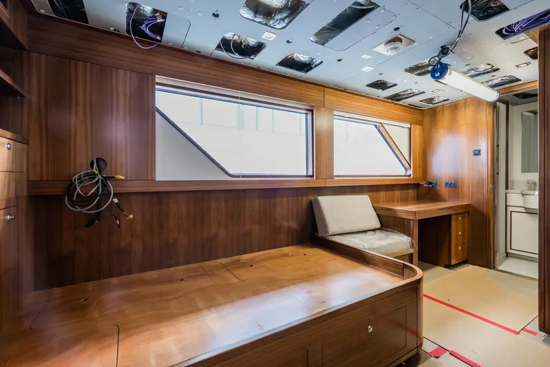 Valeria Yacht Photos Pics 1975 Feadship Motoryacht interior with wooden paneling, large windows, and seating area.