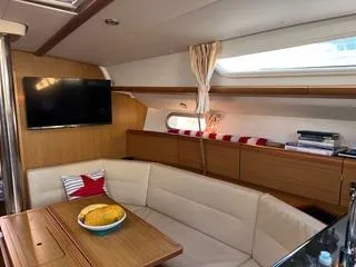 Beckon Yacht Photos Pics Interior of 2010 Jeanneau Sun Odyssey 39i Performance yacht with cozy seating and modern amenities.