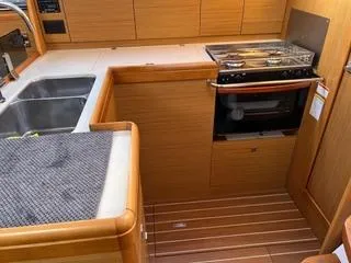 Beckon Yacht Photos Pics Interior of 2010 Jeanneau Sun Odyssey 39i Performance yacht kitchen with stove and sink.
