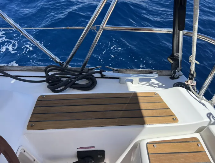 Beckon Yacht Photos Pics Cockpit of 2010 Jeanneau Sun Odyssey 39i Performance sailboat with teak seating and ocean view.