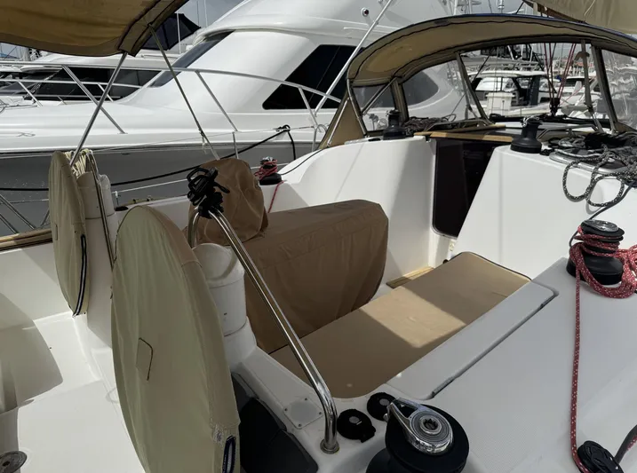 Beckon Yacht Photos Pics Cockpit of 2010 Jeanneau Sun Odyssey 39i Performance sailboat, featuring covered seating and winches.