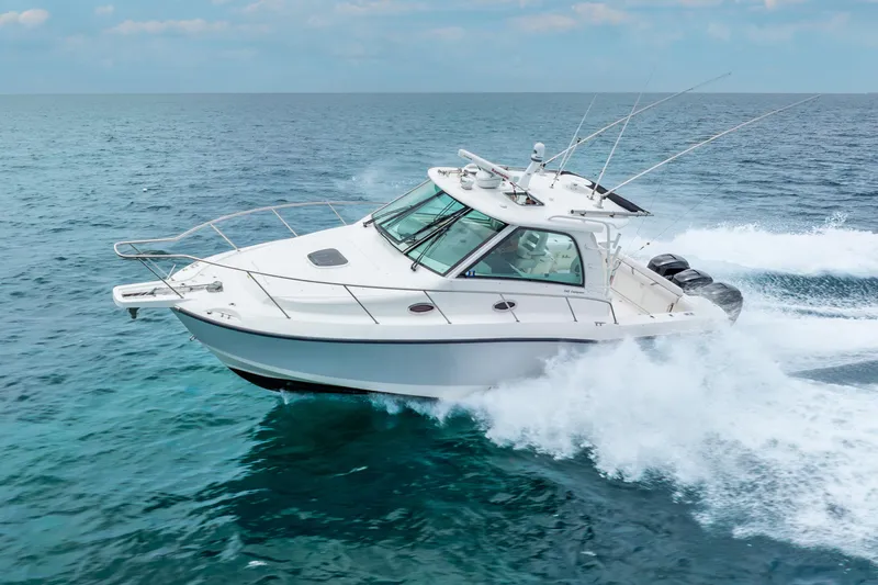 Reel Blessing Yacht Photos Pics 2012 Boston Whaler 345 Conquest cruising on open ocean waters.