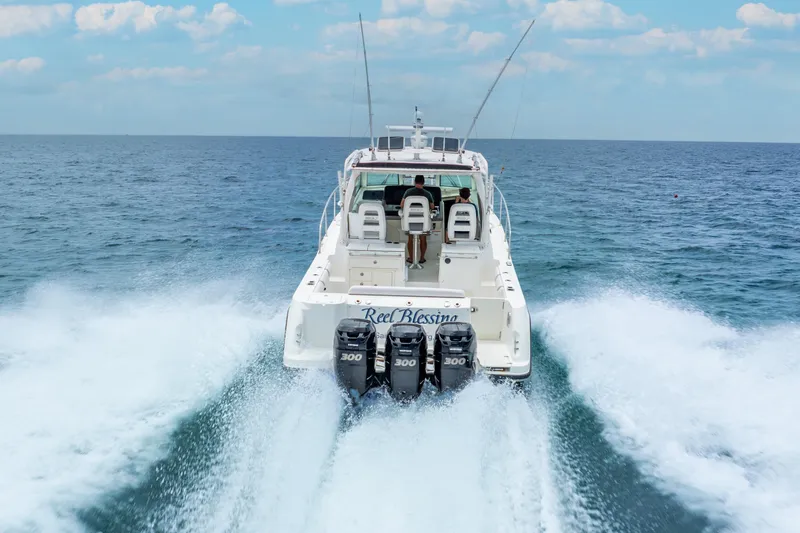 Reel Blessing Yacht Photos Pics Boston Whaler 345 Conquest 2012 cruising on open sea with powerful engines.