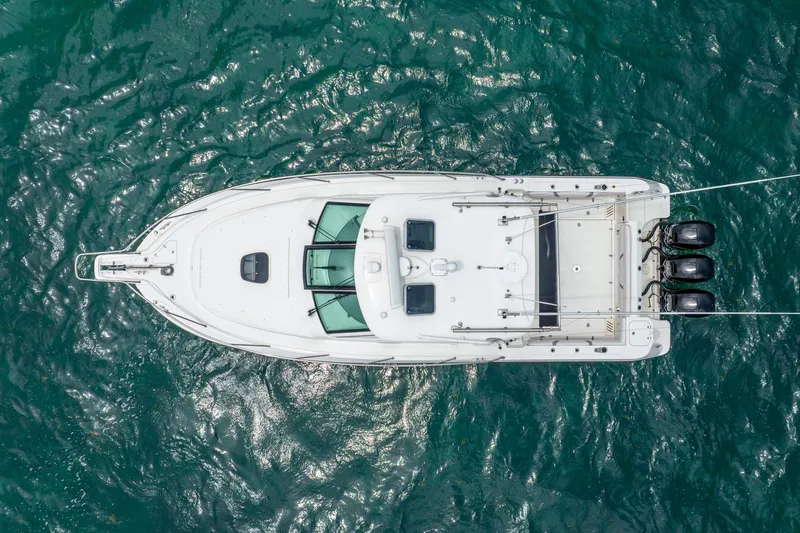 Reel Blessing Yacht Photos Pics Overhead view of 2012 Boston Whaler 345 Conquest boat on water.