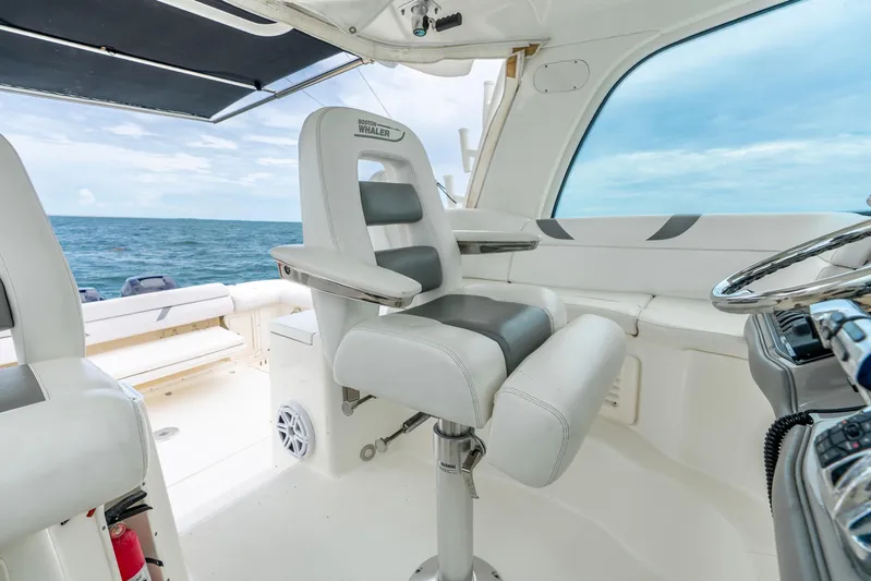 Reel Blessing Yacht Photos Pics 2012 Boston Whaler 345 Conquest helm with ocean view and luxury seating.