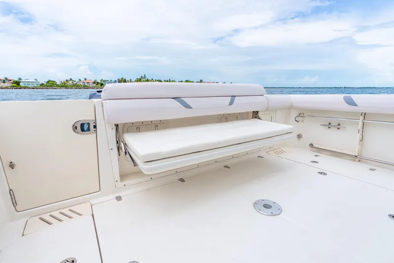 Reel Blessing Yacht Photos Pics 2012 Boston Whaler 345 Conquest boat deck with fold-out seating, ocean view.