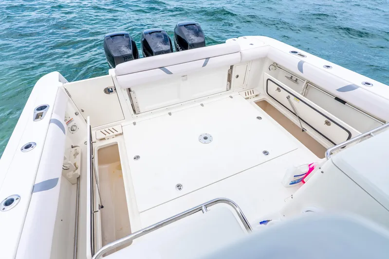Reel Blessing Yacht Photos Pics 2012 Boston Whaler 345 Conquest boat deck with triple outboard motors on the water.