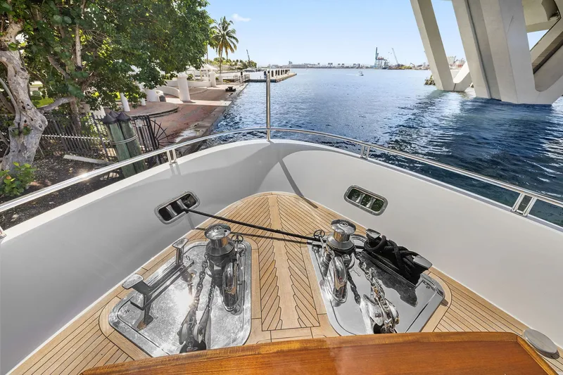 Notorious Yacht Photos Pics Sanlorenzo SL106 yacht bow view, 2017 model, docked near a scenic waterfront.
