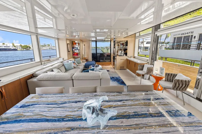 Notorious Yacht Photos Pics Luxurious interior of 2017 Sanlorenzo SL106 yacht with elegant furnishings and panoramic windows.