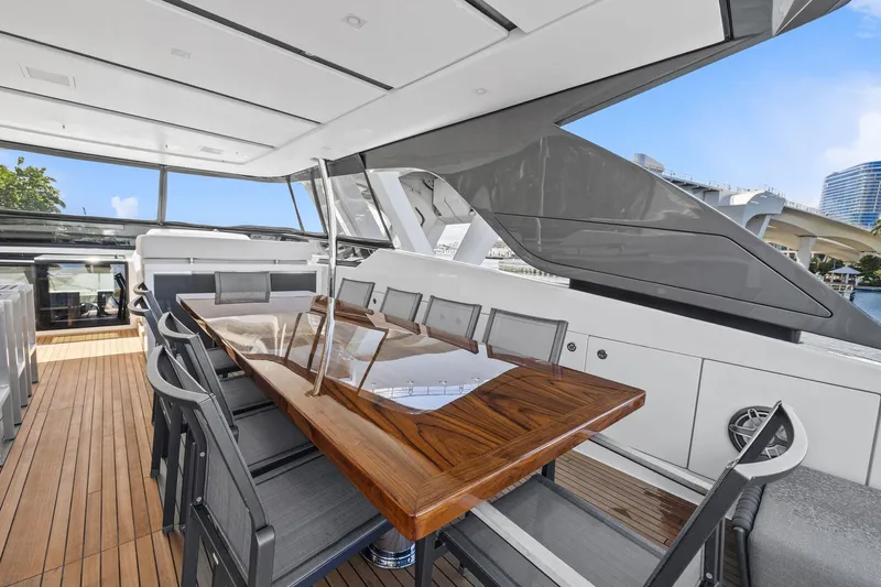 Notorious Yacht Photos Pics Luxurious 2017 Sanlorenzo SL106 yacht with elegant outdoor dining area and sleek design.