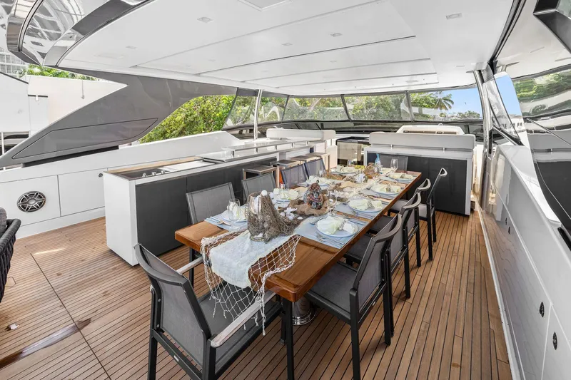 Notorious Yacht Photos Pics Luxurious 2017 Sanlorenzo SL106 yacht with elegant outdoor dining area set for guests.