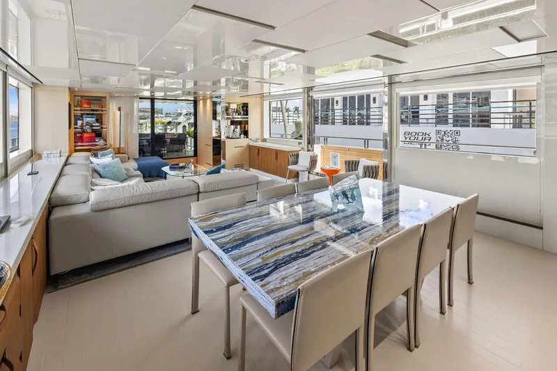 Notorious Yacht Photos Pics Luxurious interior of 2017 Sanlorenzo SL106 yacht with elegant dining and seating areas.