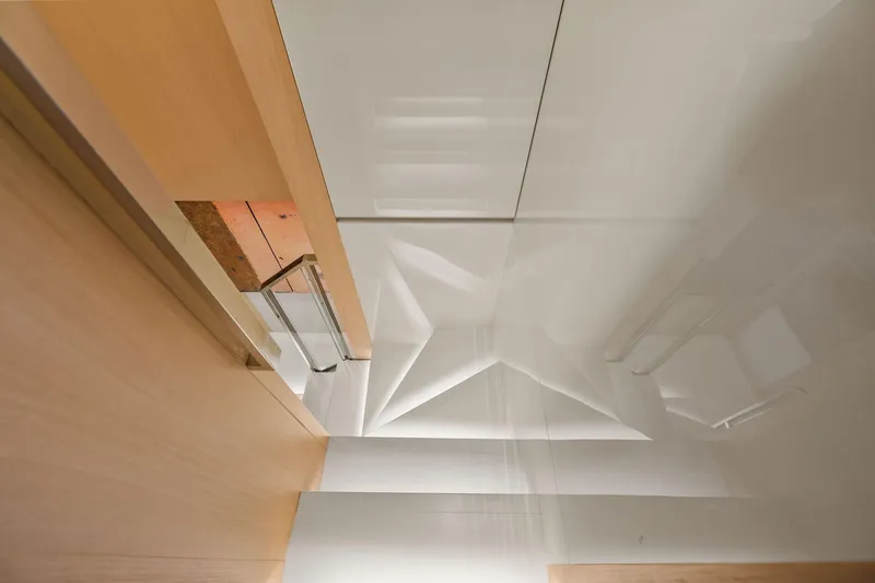 Notorious Yacht Photos Pics Modern interior design of Sanlorenzo SL106 yacht, 2017 model, featuring sleek lines and reflective surfaces.