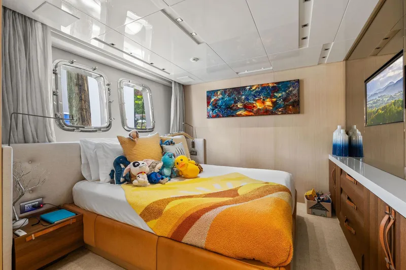 Notorious Yacht Photos Pics Luxurious Sanlorenzo SL106 2017 yacht bedroom with plush toys and vibrant decor.