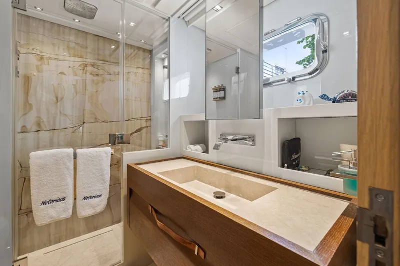 Notorious Yacht Photos Pics Luxurious bathroom on 2017 Sanlorenzo SL106 yacht with elegant marble and modern fixtures.