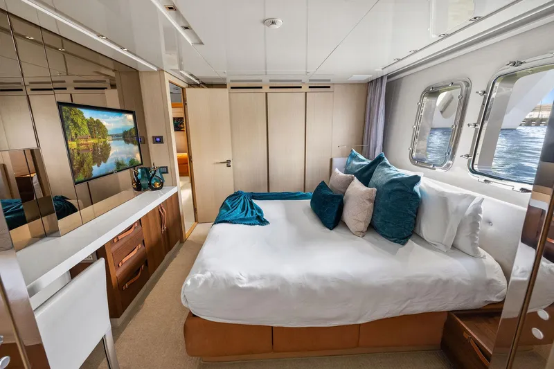 Notorious Yacht Photos Pics Luxurious bedroom interior of 2017 Sanlorenzo SL106 yacht with elegant decor and ocean view.