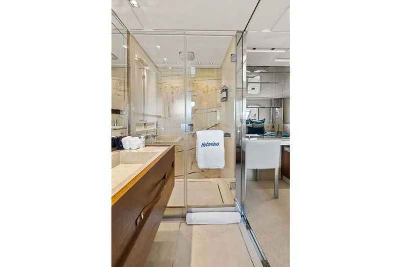 Notorious Yacht Photos Pics Luxurious bathroom on 2017 Sanlorenzo SL106 yacht with glass shower and elegant decor.