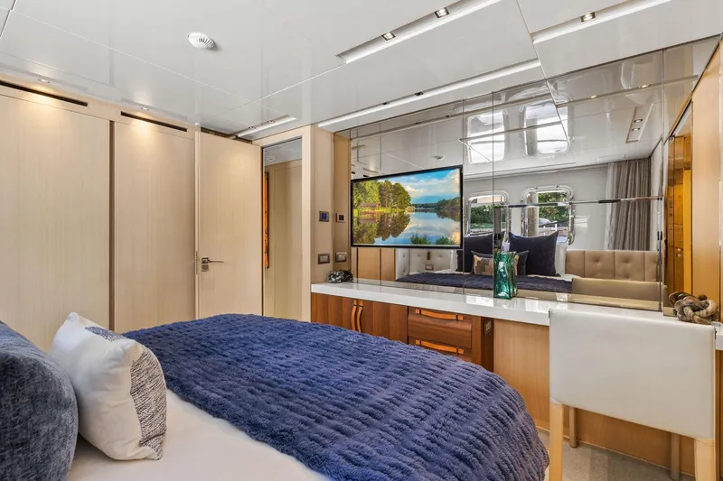 Notorious Yacht Photos Pics Luxurious bedroom interior of 2017 Sanlorenzo SL106 yacht with modern decor and large mirror.
