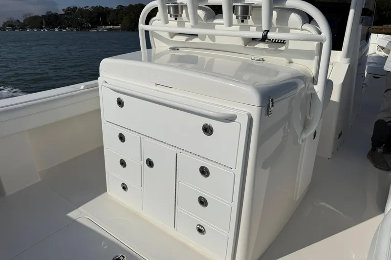 Yacht Photos Pics 2020 Regulator 31 boat with white storage console and rod holders on deck.