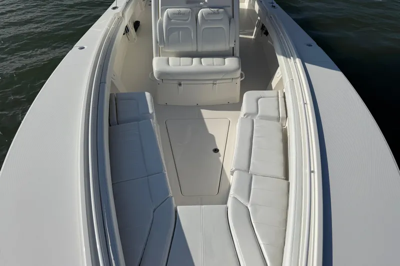  Yacht Photos Pics 2020 Regulator 31 boat interior with white seating and spacious deck.