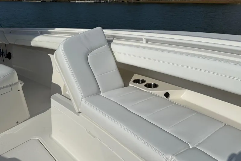  Yacht Photos Pics 2020 Regulator 31 boat interior with white cushioned seating and cup holders.