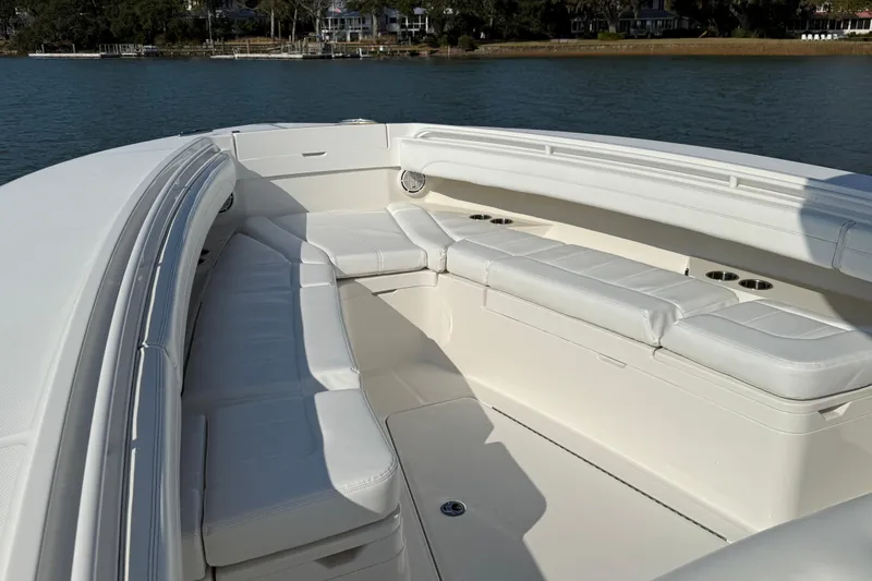  Yacht Photos Pics 2020 Regulator 31 boat with spacious white seating area on calm water.