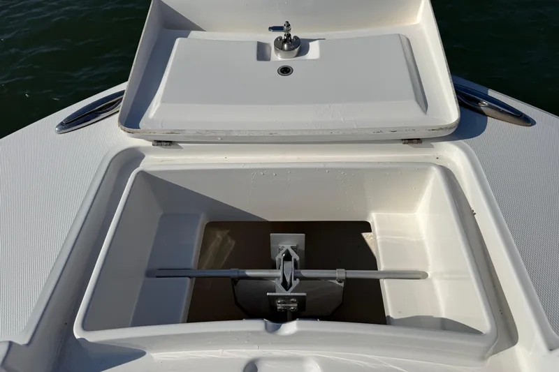  Yacht Photos Pics Anchor storage compartment on a 2020 Regulator 31 boat, featuring a clean, white design.