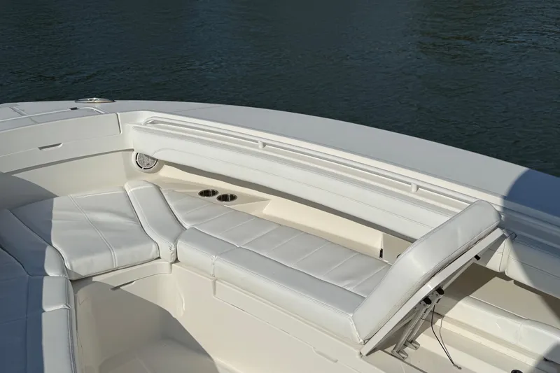  Yacht Photos Pics 2020 Regulator 31 boat interior with white cushioned seating and cup holders.