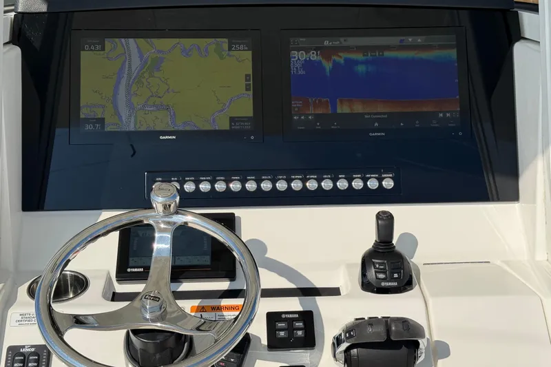  Yacht Photos Pics Control panel of a 2020 Regulator 31 boat with Garmin navigation displays.