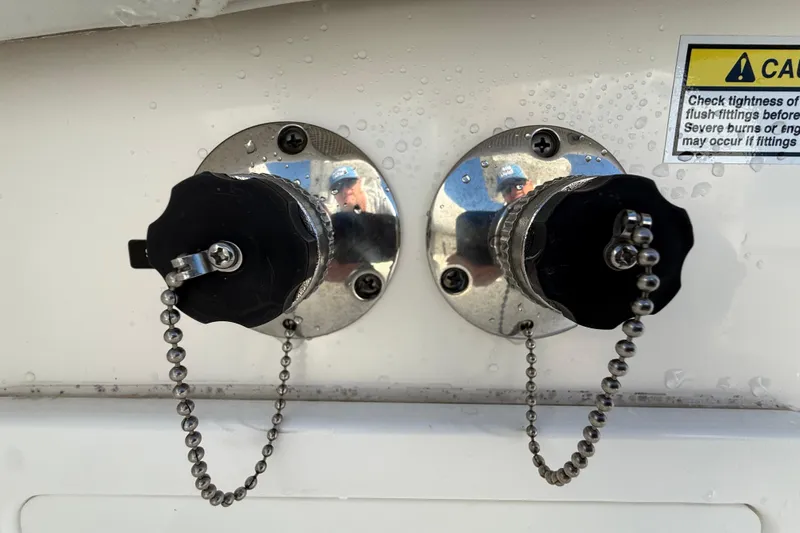  Yacht Photos Pics 2020 Regulator 31 boat fittings with safety warning label and water droplets.