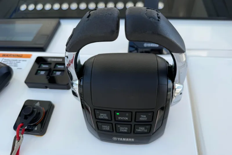  Yacht Photos Pics Yamaha throttle control on 2020 Regulator 31 boat dashboard with various control buttons.