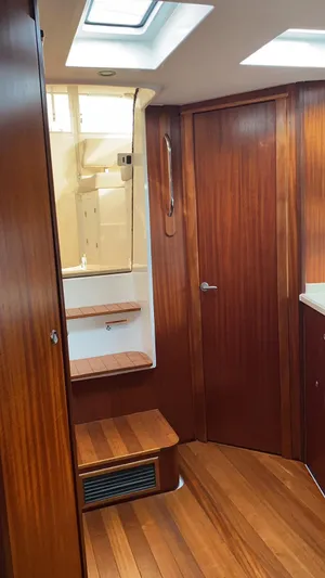  Yacht Photos Pics Interior of 2015 Pursuit SC 365i Sport Coupe with wooden flooring and stairs.