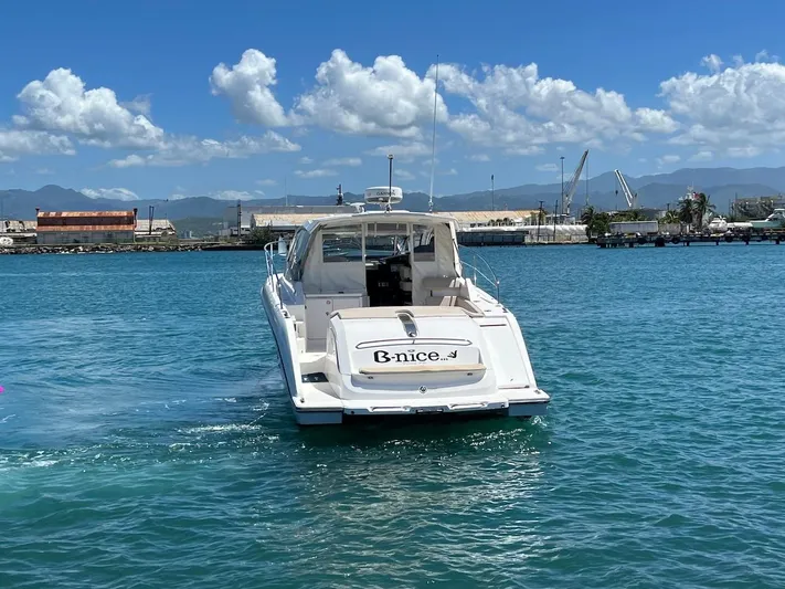  Yacht Photos Pics 2015 Pursuit SC 365i Sport Coupe on blue water, clear sky background.