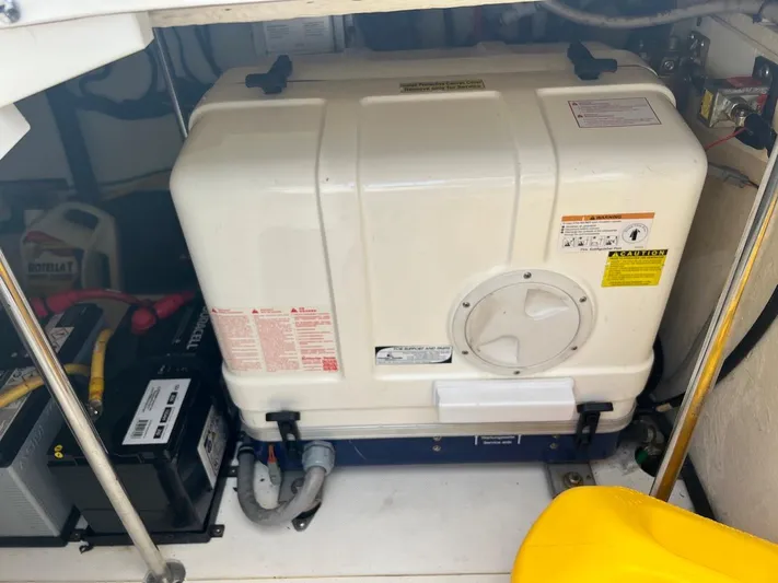  Yacht Photos Pics 2015 Pursuit SC 365i Sport Coupe engine compartment with battery and generator.