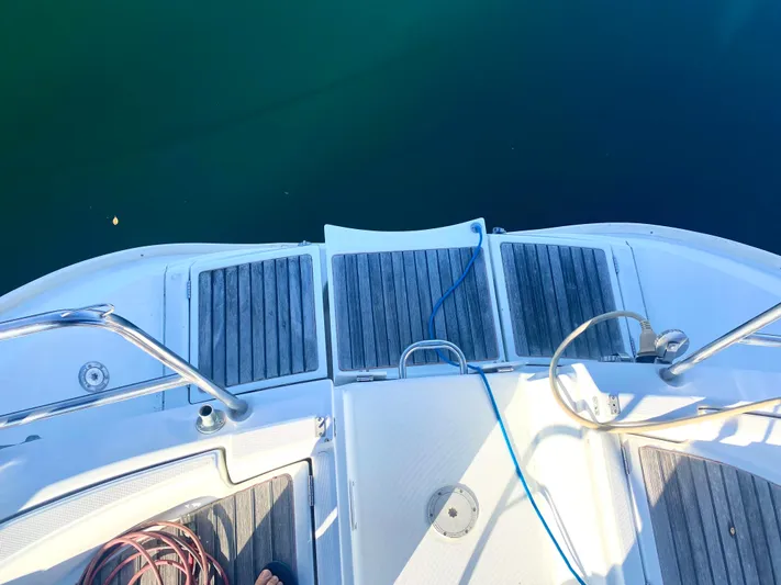 Alpha Carina Yacht Photos Pics Beneteau Oceanis 440 yacht stern view, 1993 model, with teak decking and mooring lines.