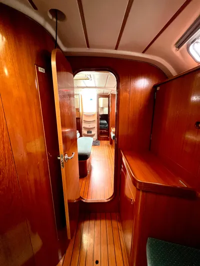 Alpha Carina Yacht Photos Pics Interior of 1993 Beneteau Oceanis 440 sailboat with wooden finish and cozy cabin layout.