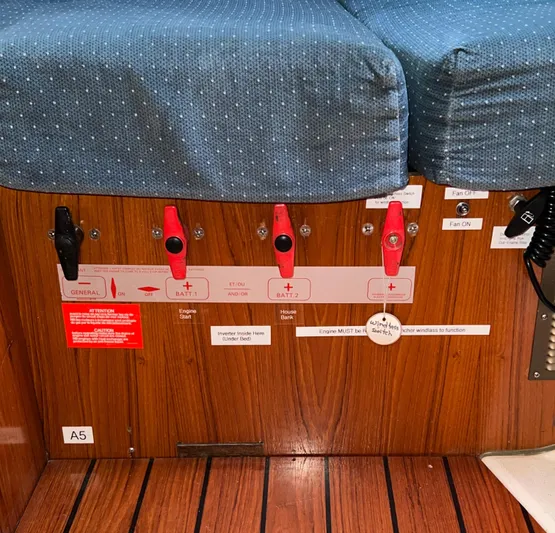 Alpha Carina Yacht Photos Pics Control panel on a 1993 Beneteau Oceanis 440 yacht with switches and labels.