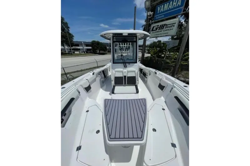  Yacht Photos Pics 2023 Tidewater 292 CC Adventure boat interior with seating and storage compartments.