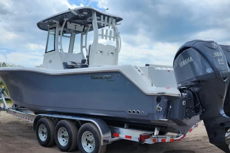  Yacht Photos Pics 2023 Tidewater 292 CC Adventure boat on trailer with Yamaha engine.