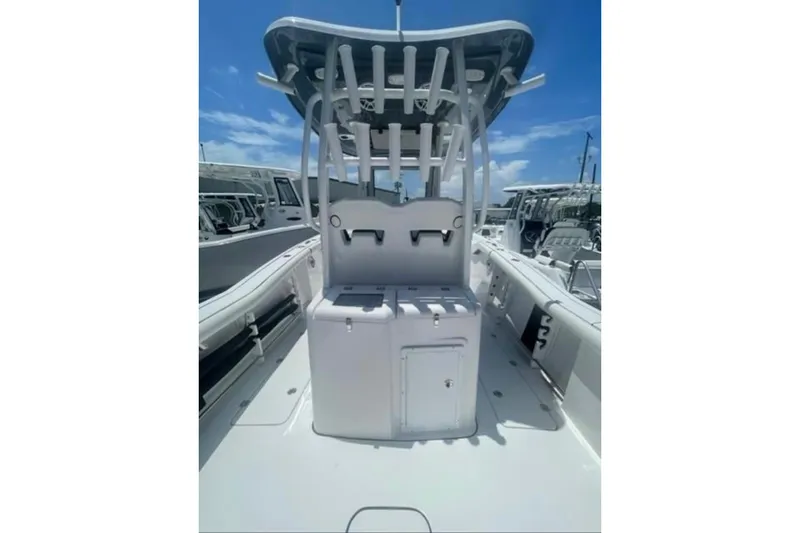  Yacht Photos Pics 2023 Tidewater 292 CC Adventure boat interior with rod holders and storage compartments.