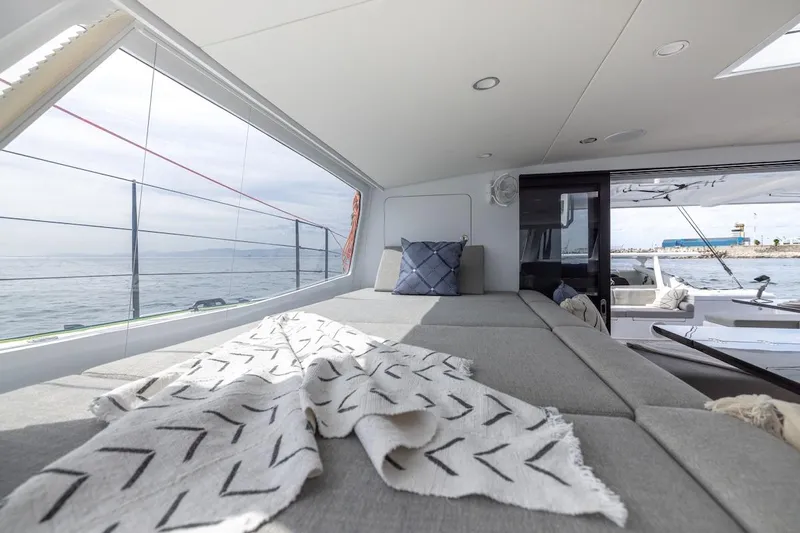  Yacht Photos Pics Luxurious interior of 2027 Balance 580 yacht with ocean view and cozy seating area.